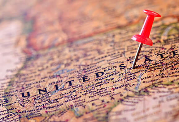 Road map of the United States of America with a red push pin stuck somewhere in Missouri