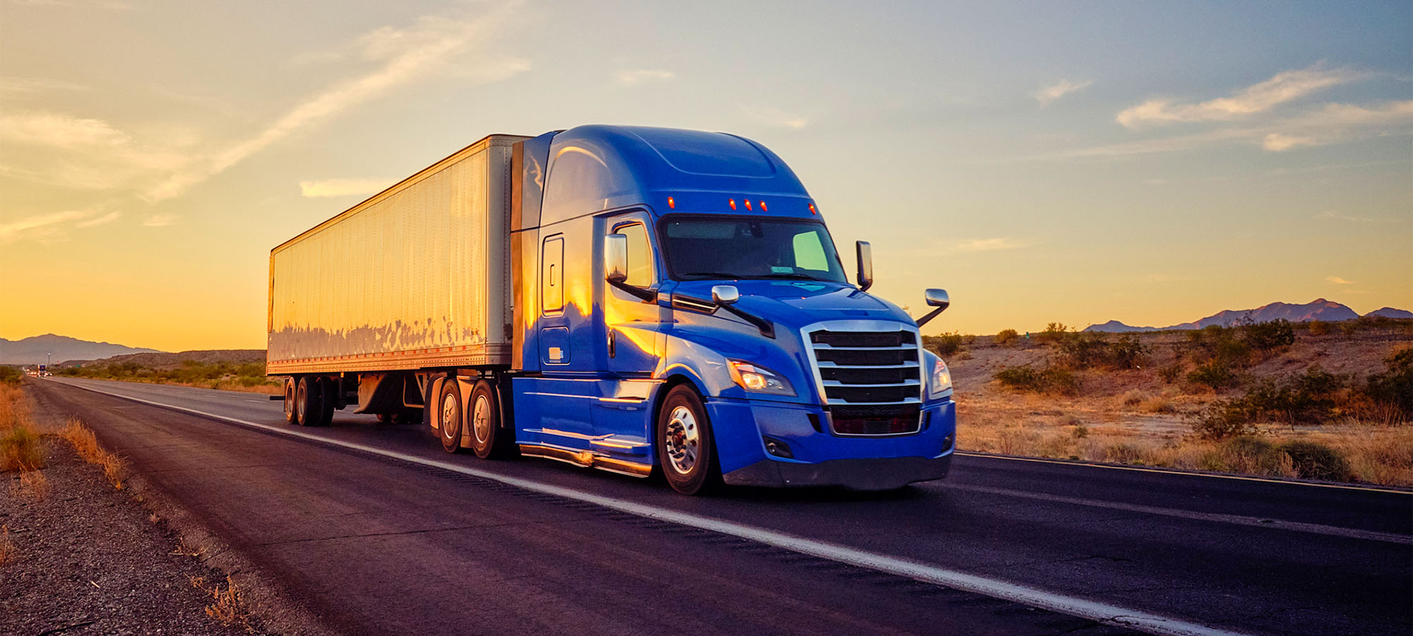 Blue semi-truck shipping materials.